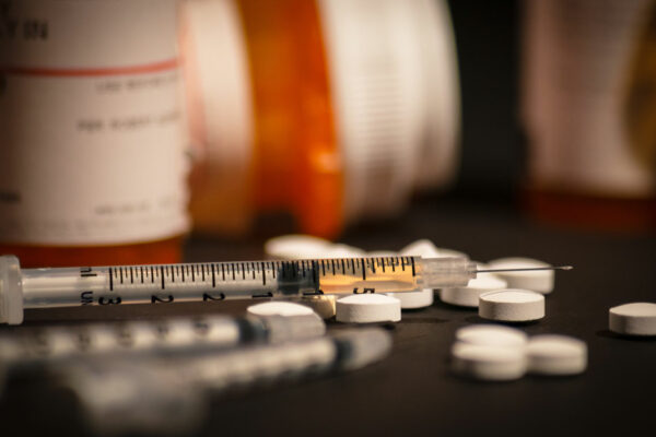 Loaded Syringe, Pills, Prescription Bottles