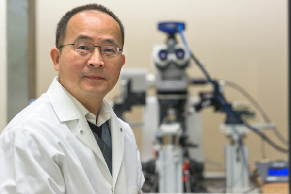 Dr. Jun Wang Sits In His Lab