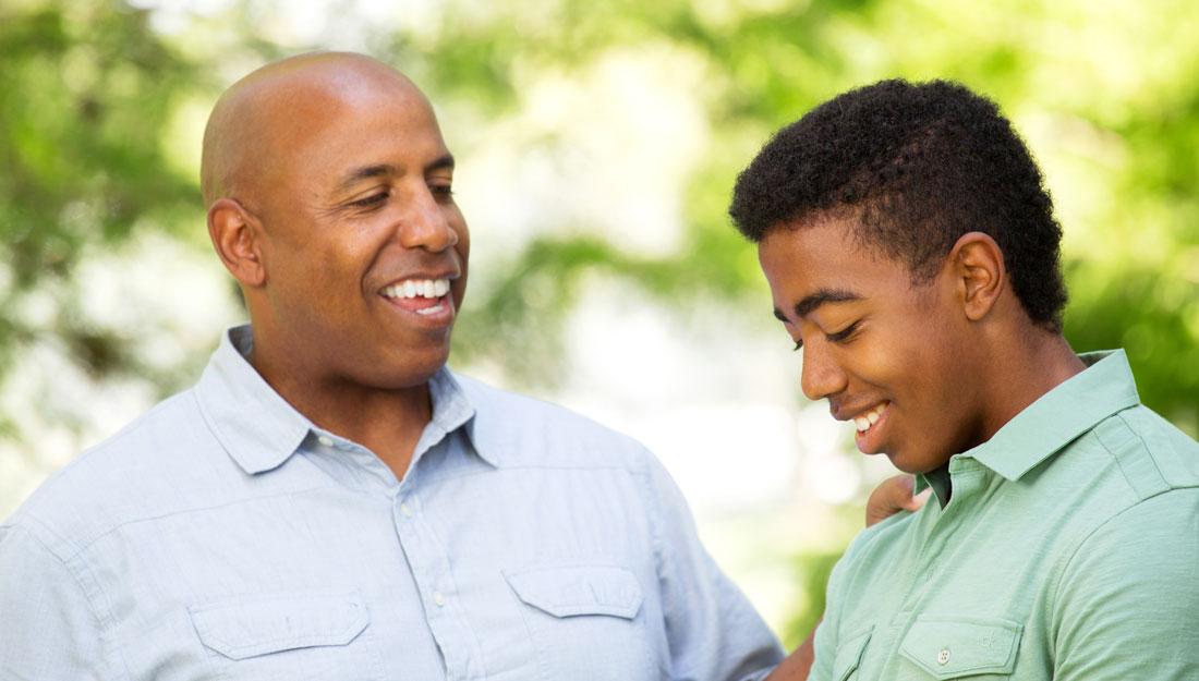 Father talking and spending time with his son.