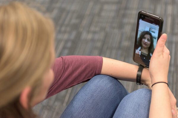 Young Woman Speaking With A Medical Provider Over A Video Call.