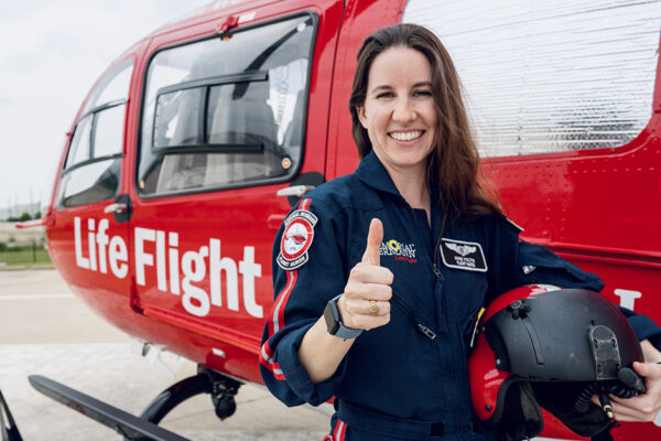 Anne Voltin In Front Of A Life Flight Helicopter