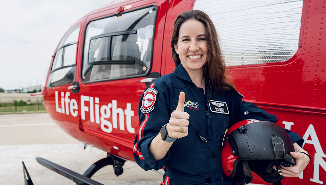 Anne Voltin in front of a life flight helicopter