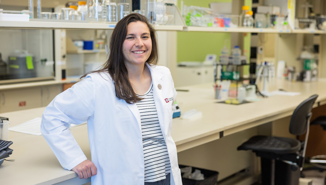 Jaclyn Iannucci stands in a laboratory