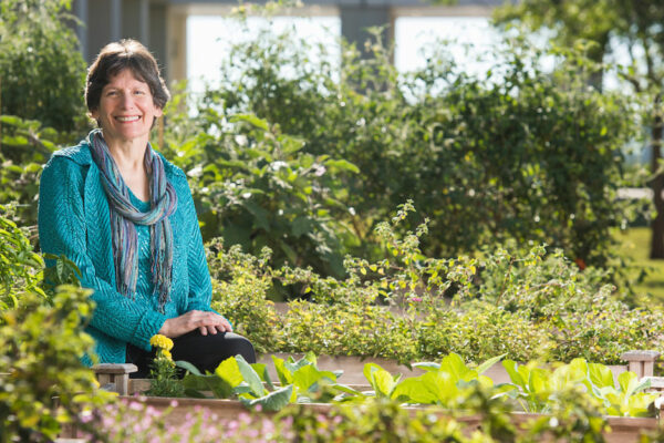 Marcia Ory Sits In A Garden