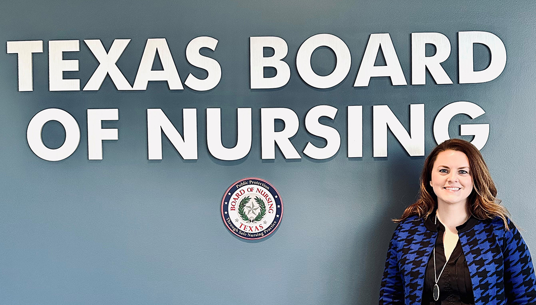 Elise McDermott in front of Texas Board of Nursing sign