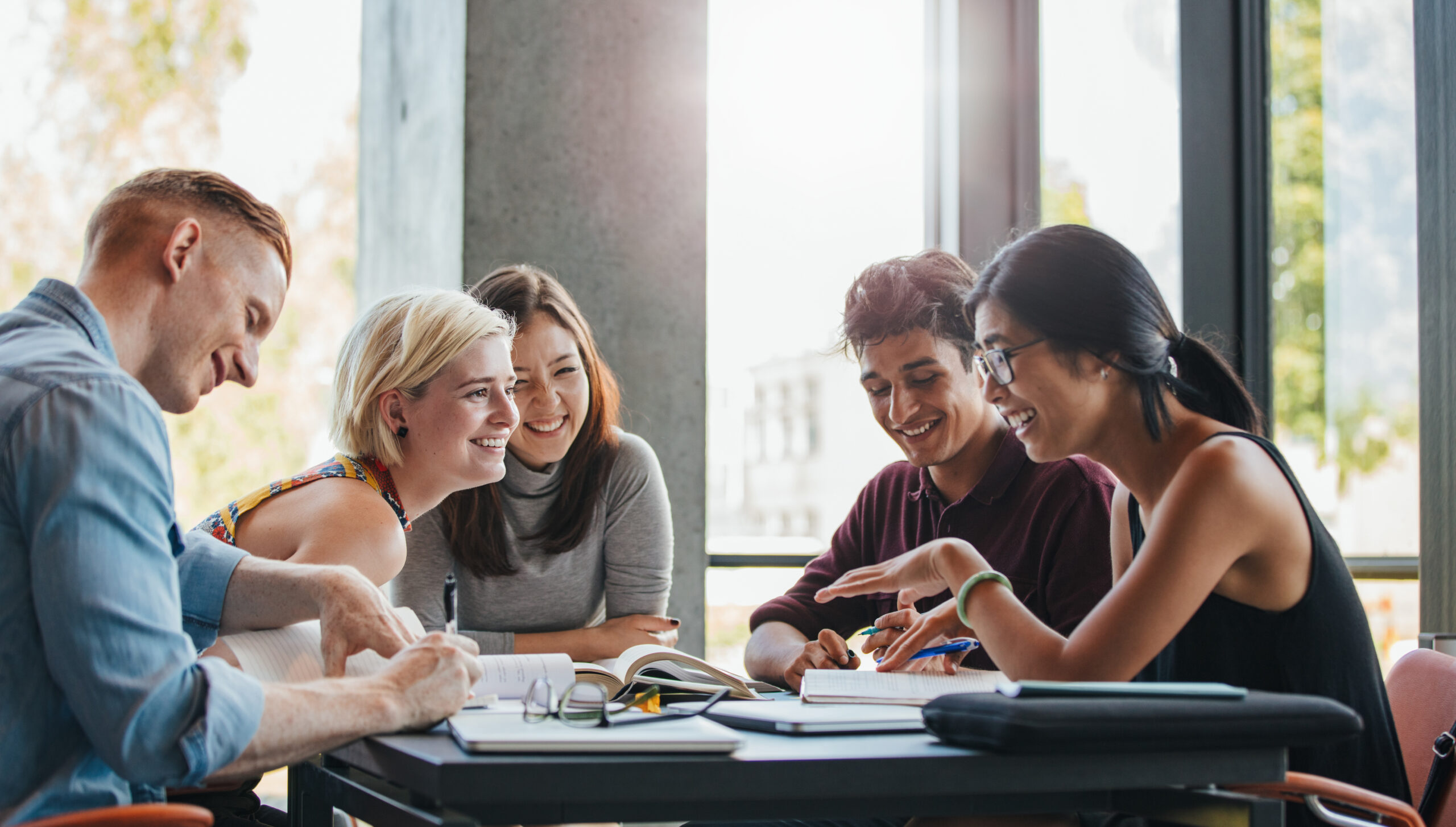 Group of students studying in college library