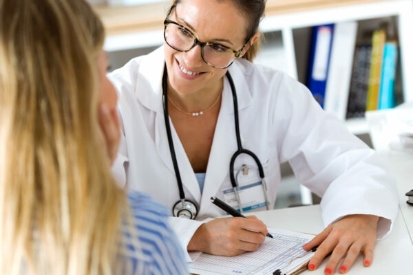 Female Doctor Explaining Diagnosis To Her Patient.