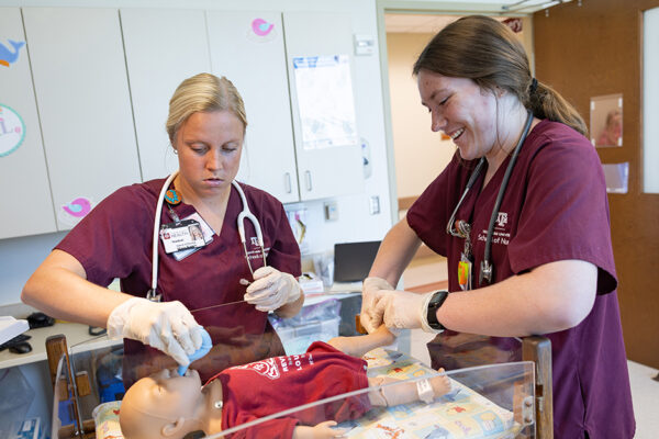 Nursing Students During A Simulated Nursery Scenario