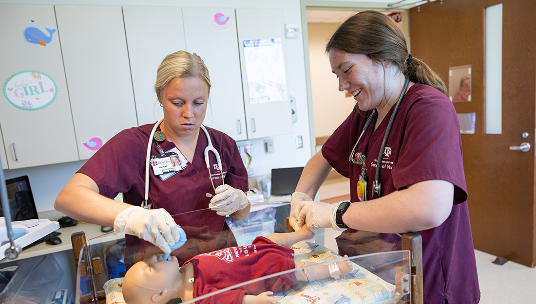 Nursing students during a simulated nursery scenario