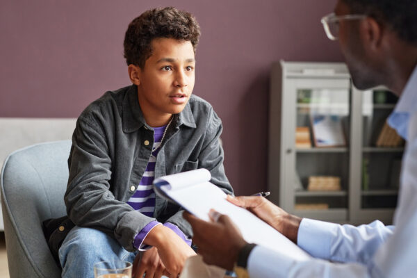 Excited Boy Talking To Health Care Provider