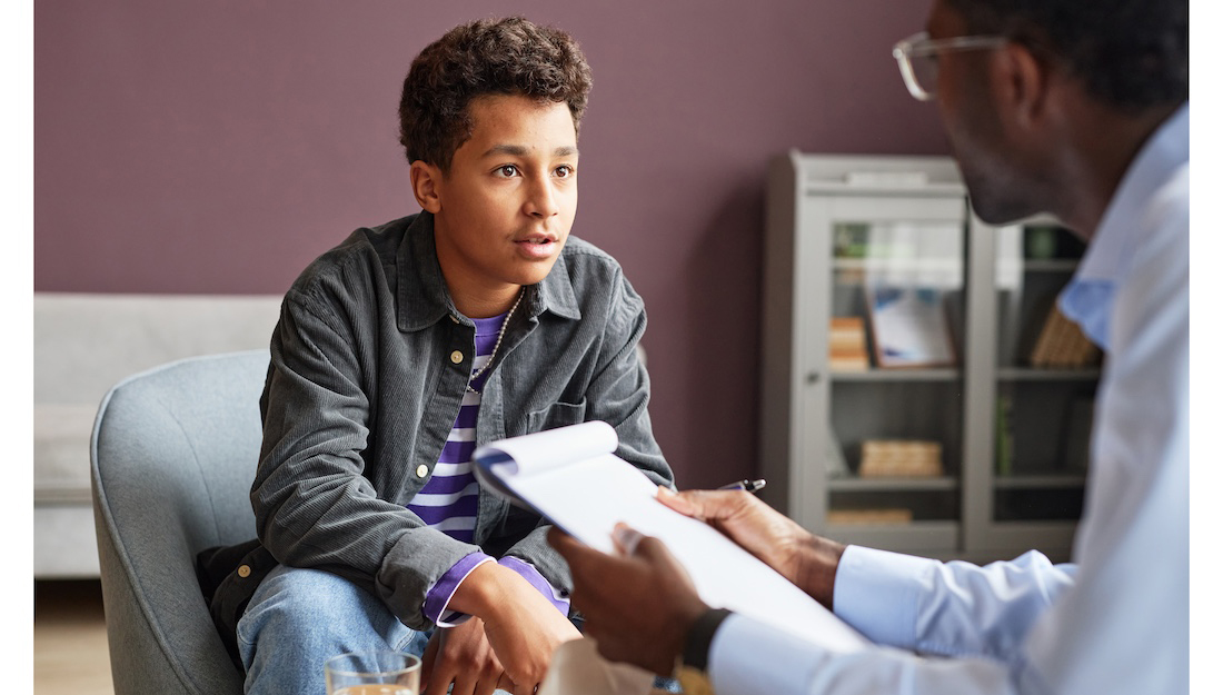 Excited Boy Talking to health care provider