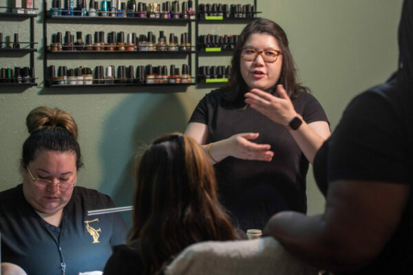 Aurora Le Gives A Presentation At A Nail Salon