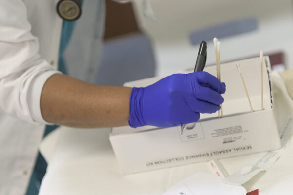 Nurse With Sexual Assault Evidence Collection Kit