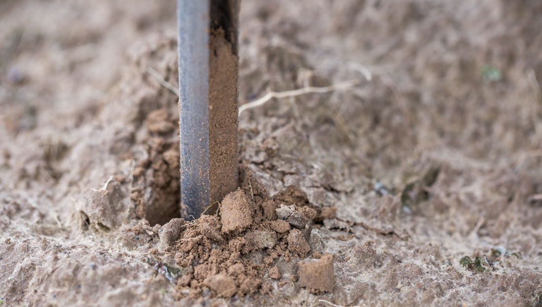 probe taking sample of soil to test for heavy metals