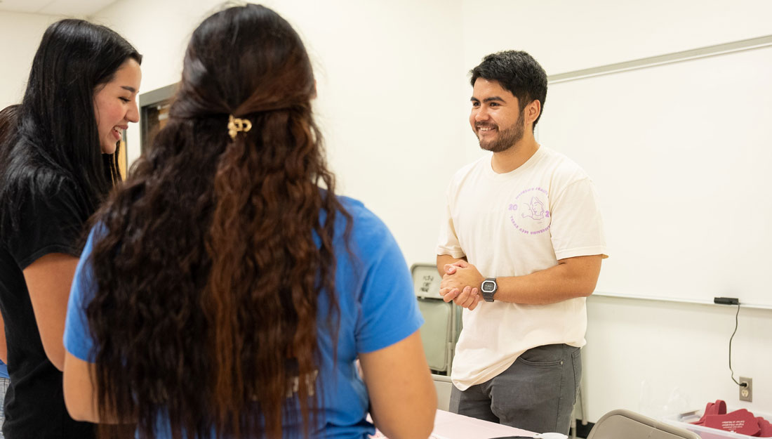 Tabir Rodriguez '27 welcomes attendees at the Women's Health Fair