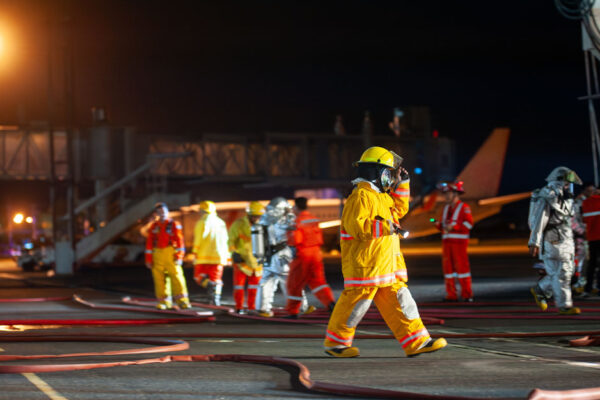 Firefighters Working In An Airport At Night