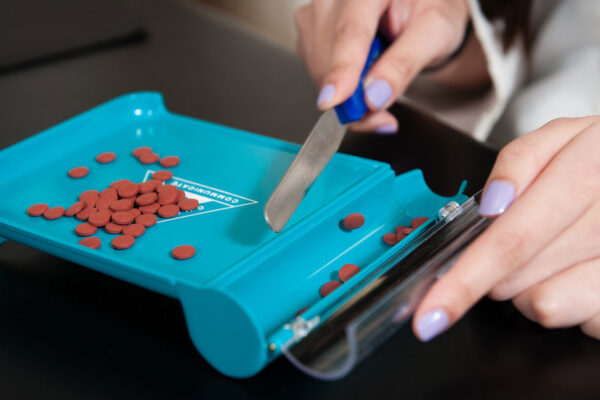 Closeup Of Professional Counting Prescription Pills
