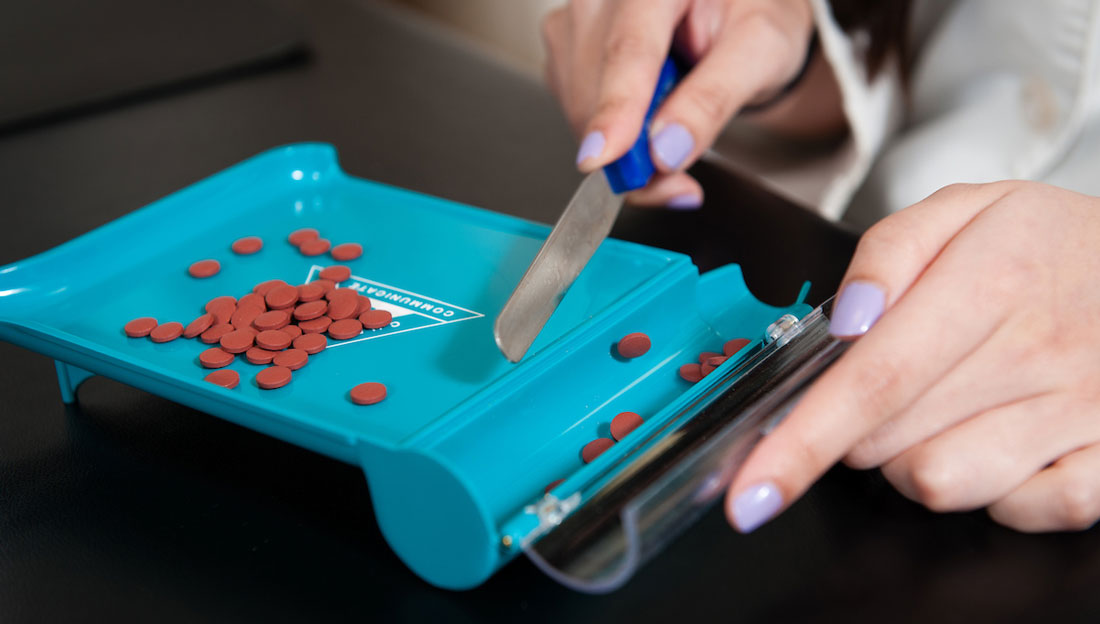 closeup of professional counting prescription pills